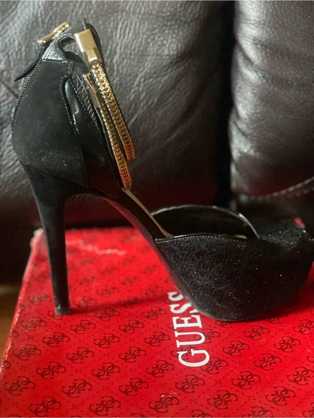 black peep-toe platform high heels by Guess featuring metallic gold double-wrap
